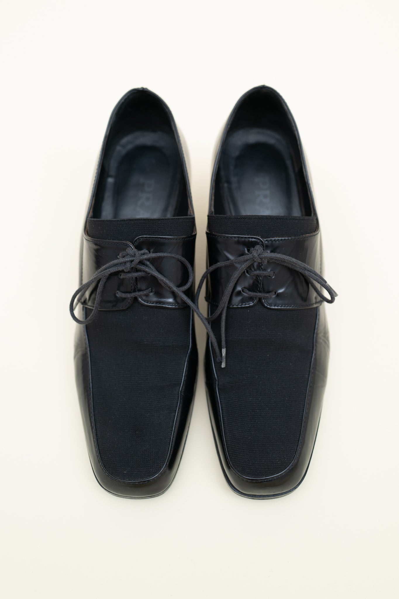 PRADA HEELED LOAFERS