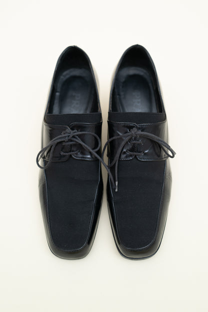 PRADA HEELED LOAFERS